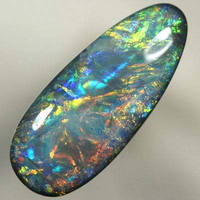 SOLID BLACK OPAL 3480 Beautiful bright burning orange together with green and blue. Top quality, always moving fire. SEE VIDEO